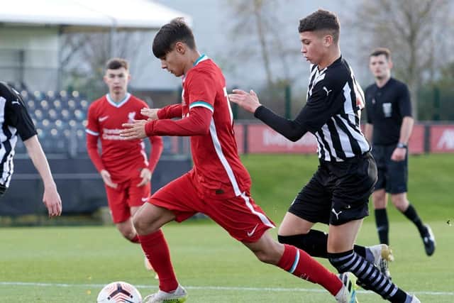 Oakley Cannonier of Liverpool and Jamie Miley of Newcastle United in action during the U18 Premier League game at The Kirkby Academy on October 31, 2020 in Kirkby, England. (Photo by Nick Taylor/Liverpool FC/Liverpool FC via Getty Images)
