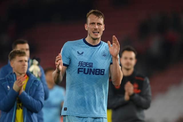 Dan Burn of Newcastle United applauds the fans after the Premier League match between Southampton and Newcastle United at St Mary's Stadium on March 10, 2022 in Southampton, England.  (Photo by Mike Hewitt/Getty Images)