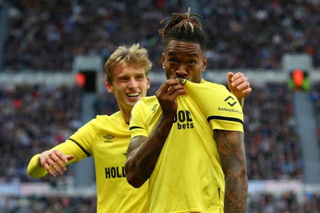 Ivan Toney kisses the badge on his shirt after scoring at St James's Park in November.
