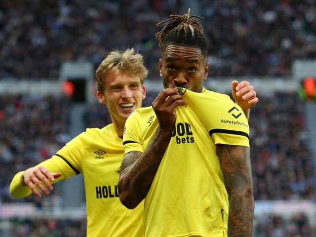 Ivan Toney kisses the badge on his shirt after scoring at St James's Park in November.