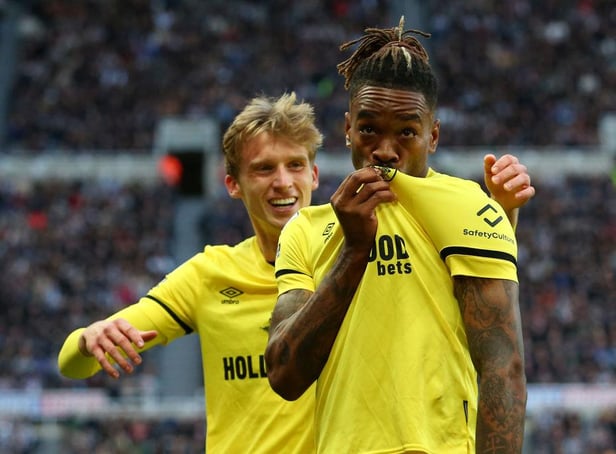 Ivan Toney kisses the badge on his shirt after scoring at St James's Park in November.
