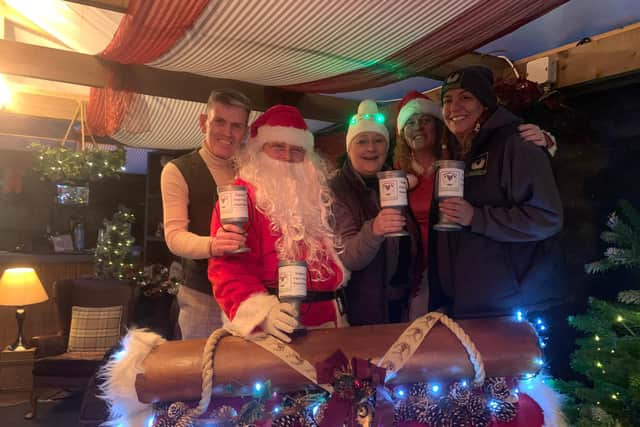 Carl Mowatt and Santa Claus with the Hebburn Helps team Jo Durkin, Angi Comerford, Alison Wilson