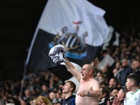 Newcastle United fans celebrates victory over Tottenham Hotspur.
