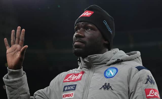 MILAN, ITALY - FEBRUARY 12: Kalidou Koulibaly of SSC Napoli greets the fans prior to the Coppa Italia Semi Final match between FC Internazionale and SSC Napoli at Stadio Giuseppe Meazza on February 12, 2020 in Milan, Italy. (Photo by Emilio Andreoli/Getty Images)