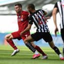 NEWCASTLE UPON TYNE, ENGLAND - JULY 26: (THE SUN OUT, THE SUN ON SUNDAY OUT) James Milner of Liverpool with Newcastles Nabil Bentaleb during the Premier League match between Newcastle United and Liverpool FC at St. James Park on July 26, 2020 in Newcastle upon Tyne, England. (Photo by Andrew Powell/Liverpool FC via Getty Images)