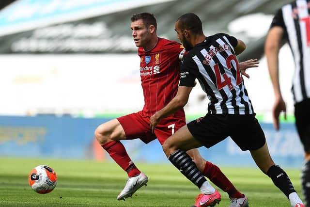 NEWCASTLE UPON TYNE, ENGLAND - JULY 26: (THE SUN OUT, THE SUN ON SUNDAY OUT) James Milner of Liverpool with Newcastles Nabil Bentaleb during the Premier League match between Newcastle United and Liverpool FC at St. James Park on July 26, 2020 in Newcastle upon Tyne, England. (Photo by Andrew Powell/Liverpool FC via Getty Images)