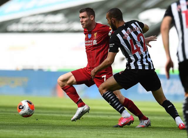 NEWCASTLE UPON TYNE, ENGLAND - JULY 26: (THE SUN OUT, THE SUN ON SUNDAY OUT) James Milner of Liverpool with Newcastles Nabil Bentaleb during the Premier League match between Newcastle United and Liverpool FC at St. James Park on July 26, 2020 in Newcastle upon Tyne, England. (Photo by Andrew Powell/Liverpool FC via Getty Images)