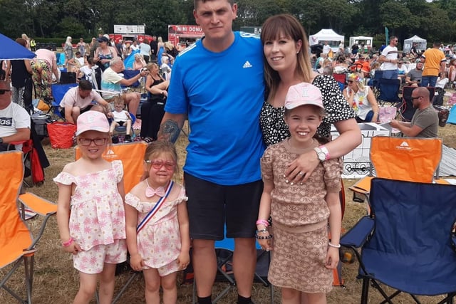 Chelsea McLellan, 30, and Stuart Ayre, 32, with Esmay, five, Arianna, four, and eight-year-old Isabella, who were looking forward to seeing Ella Henderson.