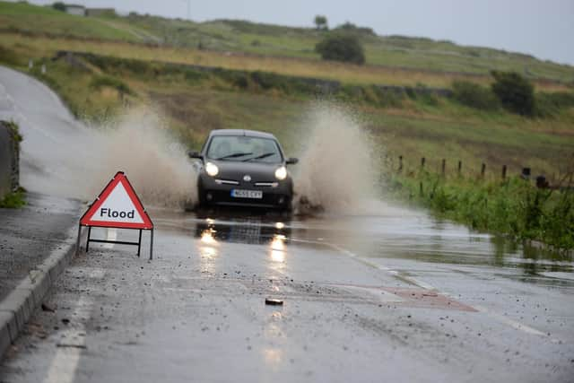 Flooding on Lizard Lane, Whitburn, in recent years. There are now plans to tackle the problem.