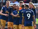 Newcastle United's win over Brentford kept them in 3rd place - making it five Premier League wins in a row  (Photo by GLYN KIRK/AFP via Getty Images)