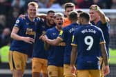 Newcastle United's win over Brentford kept them in 3rd place - making it five Premier League wins in a row  (Photo by GLYN KIRK/AFP via Getty Images)