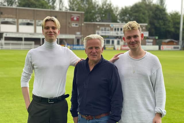 SSFC chairman Geoff Thompson, centre, with band members Alex Greenup, left, and Daniel Frend.