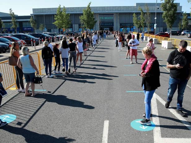 Thousands of shoppers were seen queuing for reopened shops in England