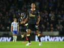 Isaac Hayden of Newcastle United celebrates after scoring their team's first goal during the Premier League match between Brighton & Hove Albion and Newcastle United at American Express Community Stadium on November 06, 2021 in Brighton, England. (Photo by Charlie Crowhurst/Getty Images)