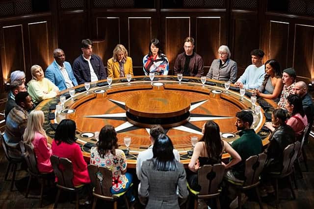 The contestants in the new series of The Traitors gather at the round table for a banishment (Picture: BBC/Studio Lambert)