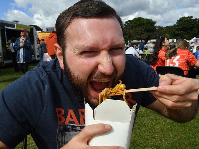 Karl Stott tucks into his noodles.