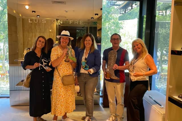 Luís Onofre luxury footwear admired by Chris, flanked by Associação Avenida da Liberdade executive director Inês Ortigão Malato (left) and (right) Portuguese Association of Tourist Guides and Tour Managers cicerone