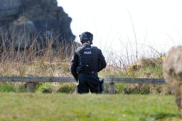 Armed police at Cleadon Hills searching for a wanted man, in his late 50s.