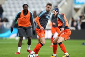 Olly Lee warms up at St James's Park while playing for Luton Town in January 2018.