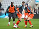 Olly Lee warms up at St James's Park while playing for Luton Town in January 2018.