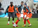 Olly Lee warms up at St James's Park while playing for Luton Town in January 2018.