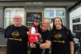 Sophia Shaw joined riders at Dougie's Tavern with ride organiser Norman Scott (left), granddad Bobby Park and pub manager Emma Scott.