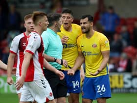 Bailey Wright remonstrates after a late penalty is awarded to Fleetwood