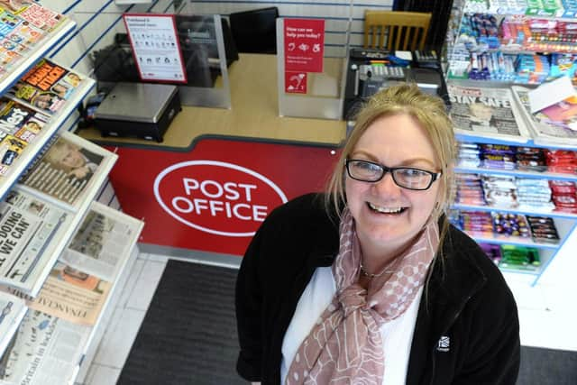 Madeline Duncan at the new Post Office counter inside of Duncan's News Hub.