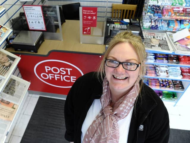 Madeline Duncan at the new Post Office counter inside of Duncan's News Hub.