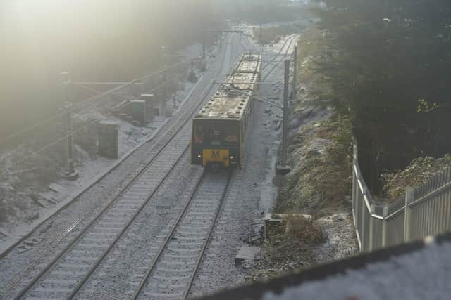 A Metro passes through the reopened line between Pelaw and South Shields.