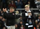 Newcastle United's new recruit Scottish defender Harrison Ashby (L) and English forward Anthony Gordon (R) applaud the fans prior to the start of the English League Cup semi final football match between Newcastle United and Southampton at St James's Park stadium in Newcastle, on January 31, 2023.  (Photo by PAUL ELLIS/AFP via Getty Images)