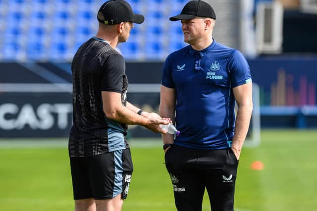 Newcastle head coach Eddie Howe speaks with Graeme Jones in Riyadh, Saudi Arabia.