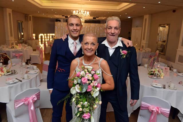 Judith Elliott Laing, who has terminal cancer, celebrates her wedding day with husband Paul Laing and son Craig Laing.