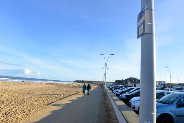 The signs have been placed high up on lampposts along the seafront promenade.