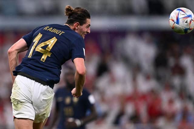 France's midfielder #14 Adrien Rabiot heads the ball during the Qatar 2022 World Cup round of 16 football match between France and Poland at the Al-Thumama Stadium in Doha on December 4, 2022. (Photo by Kirill KUDRYAVTSEV / AFP) (Photo by KIRILL KUDRYAVTSEV/AFP via Getty Images)