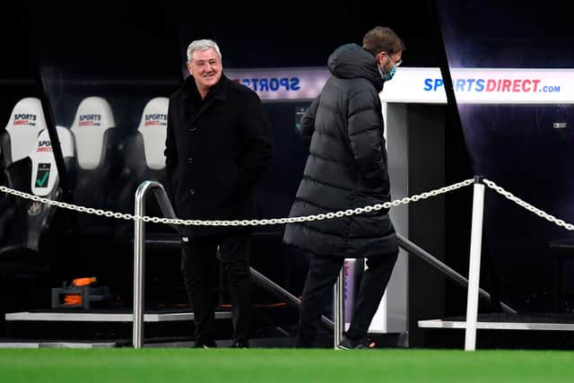 Newcastle United's English head coach Steve Bruce (L) laughs with Liverpool's German manager Jurgen Klopp ahead of the English Premier League football match between Newcastle United and Liverpool at St James' Park in Newcastle-upon-Tyne, north east England on December 30, 2020.