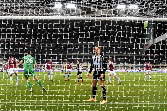 Dwight Gayle of Newcastle United reacts during the Premier League match between Newcastle United and Aston Villa at St. James Park on March 12, 2021 in Newcastle upon Tyne, England.