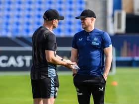Newcastle United head coach Eddie Howe speaks with Graeme Jones in Riyadh, Saudi Arabia.