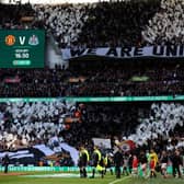 Newcastle United fans wave flags and show their support prior to the Carabao Cup Final (Photo by Julian Finney/Getty Images)