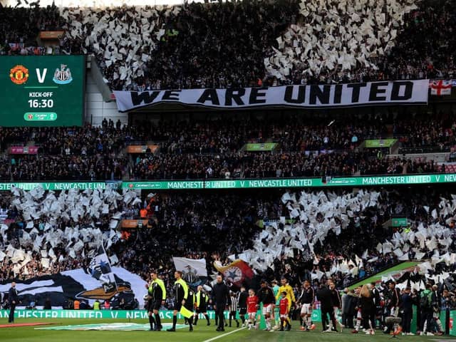 Newcastle United fans wave flags and show their support prior to the Carabao Cup Final (Photo by Julian Finney/Getty Images)