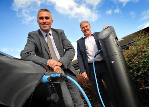 Councillor Mark Walsh at Jarrow Business Centre with Paul Lindsay and the new Electric Car Charging Point.