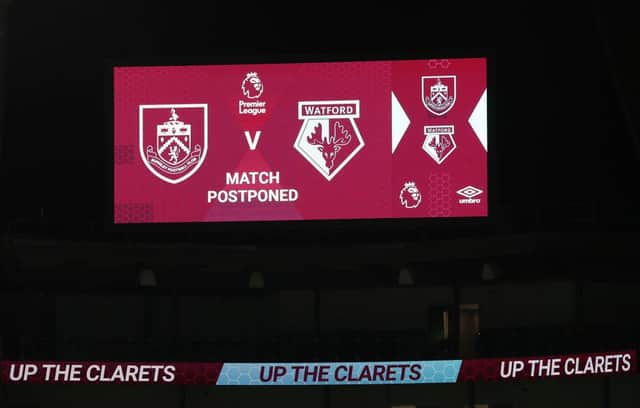 A message is seen on the LED board saying the match is called off prior to the Premier League match between Burnley and Watford at Turf Moor. (Photo by Jan Kruger/Getty Images)