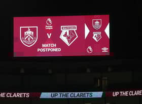 A message is seen on the LED board saying the match is called off prior to the Premier League match between Burnley and Watford at Turf Moor. (Photo by Jan Kruger/Getty Images)