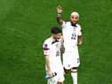 Christian Pulisic (L) and Deandre Yedlin of United States react after the 1-1 draw during the FIFA World Cup Qatar 2022 Group B match between USA and Wales at Ahmad Bin Ali Stadium on November 21, 2022 in Doha, Qatar. (Photo by Tim Nwachukwu/Getty Images)