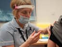 A patient receives the Pfizer BioNTech Covid-19 vaccine at a mass vaccination hub at the Centre For Life in Newcastle. Picture: PA.