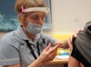 A patient receives the Pfizer BioNTech Covid-19 vaccine at a mass vaccination hub at the Centre For Life in Newcastle. Picture: PA.