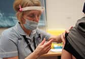A patient receives the Pfizer BioNTech Covid-19 vaccine at a mass vaccination hub at the Centre For Life in Newcastle. Picture: PA.