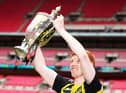 Hebburn Town's Michael Richardson celebrates with lifting the Buildbase FA Vase 2019/20 Trophy after victory in the Final at Wembley Stadium, London. PA picture.