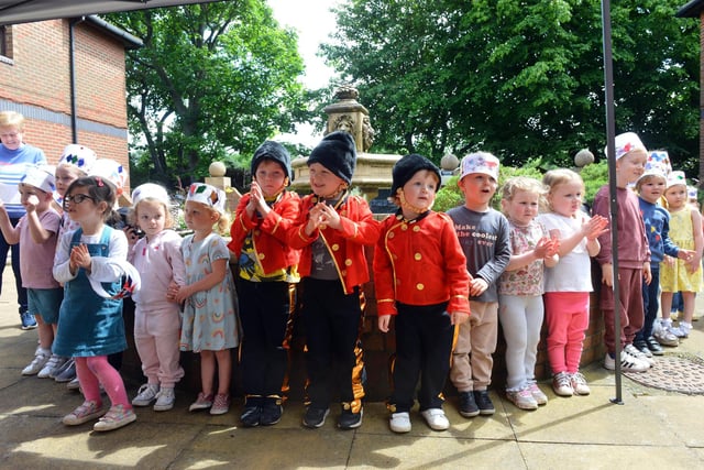 Children singing Jubilee songs for Hebburn Court Nursing Home residents.