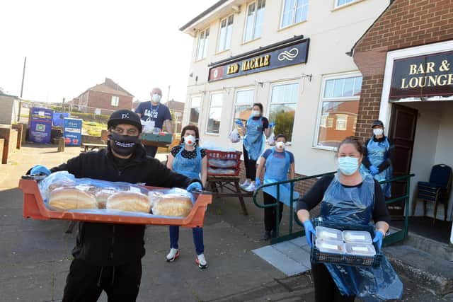 Nico Ali and Joanne Crosby make up food hampers for vulnerable residents at the Red Hackle in Jarrow.